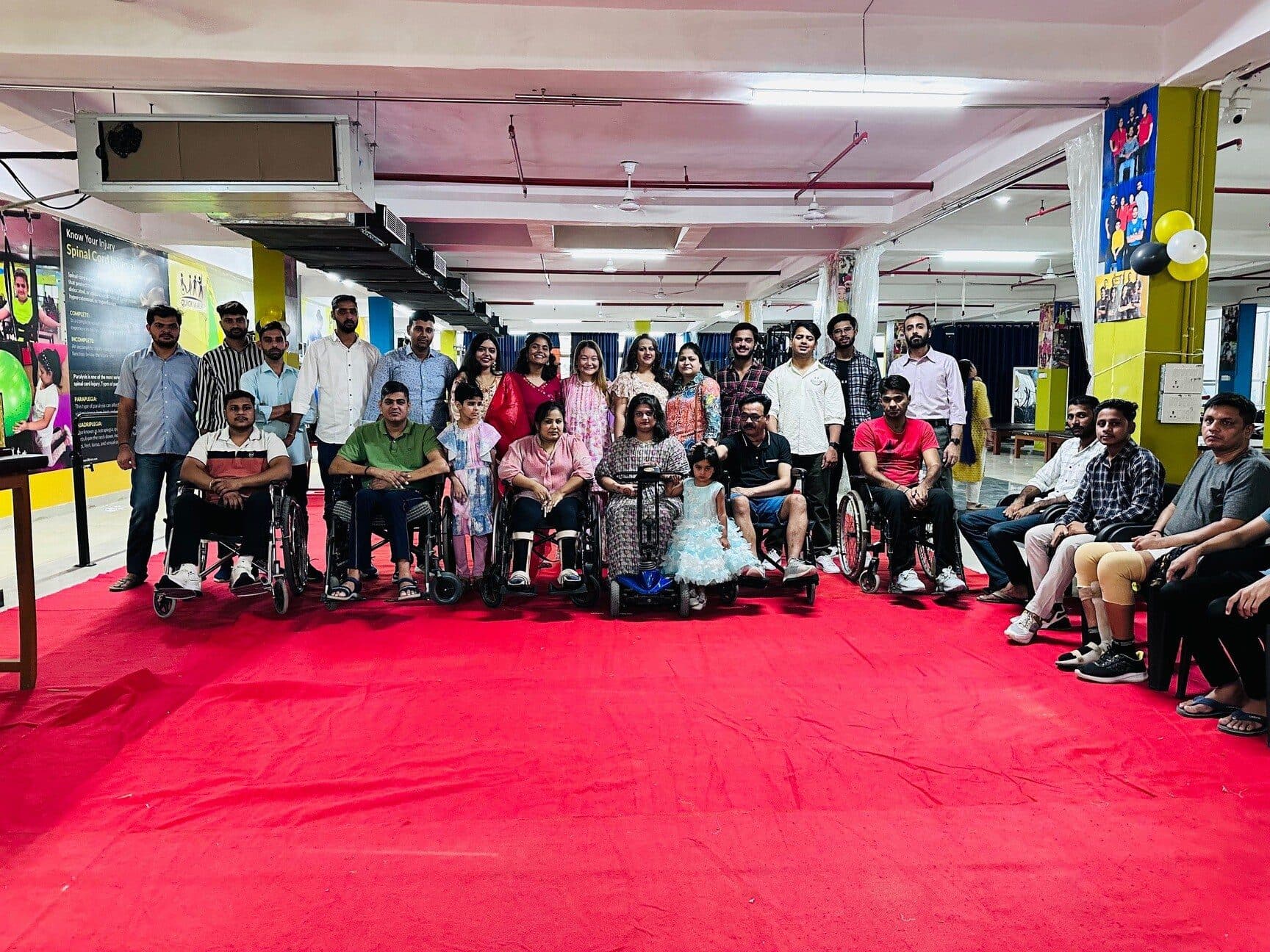 Patients, families and staff gathered on the red carpet for a celebration in the rehabilitation gym